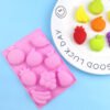 Angled view of pink 8-cavity fruit world silicone chocolate and soap mold