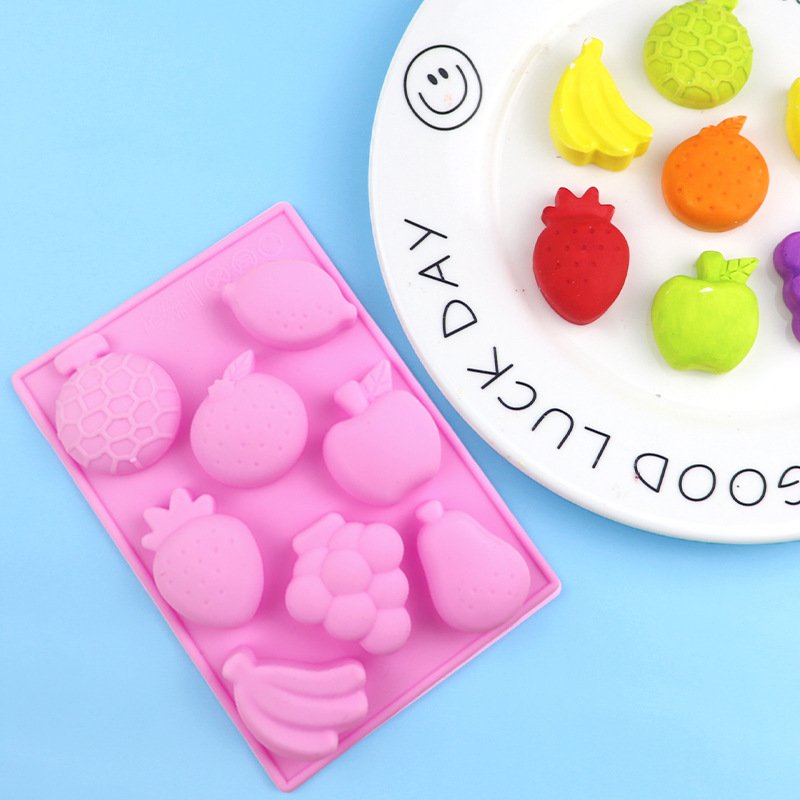 Angled view of pink 8-cavity fruit world silicone chocolate and soap mold