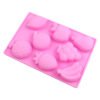 Angled view of pink 8-cavity fruit world silicone chocolate and soap mold