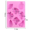 Angled view of pink 8-cavity fruit world silicone chocolate and soap mold