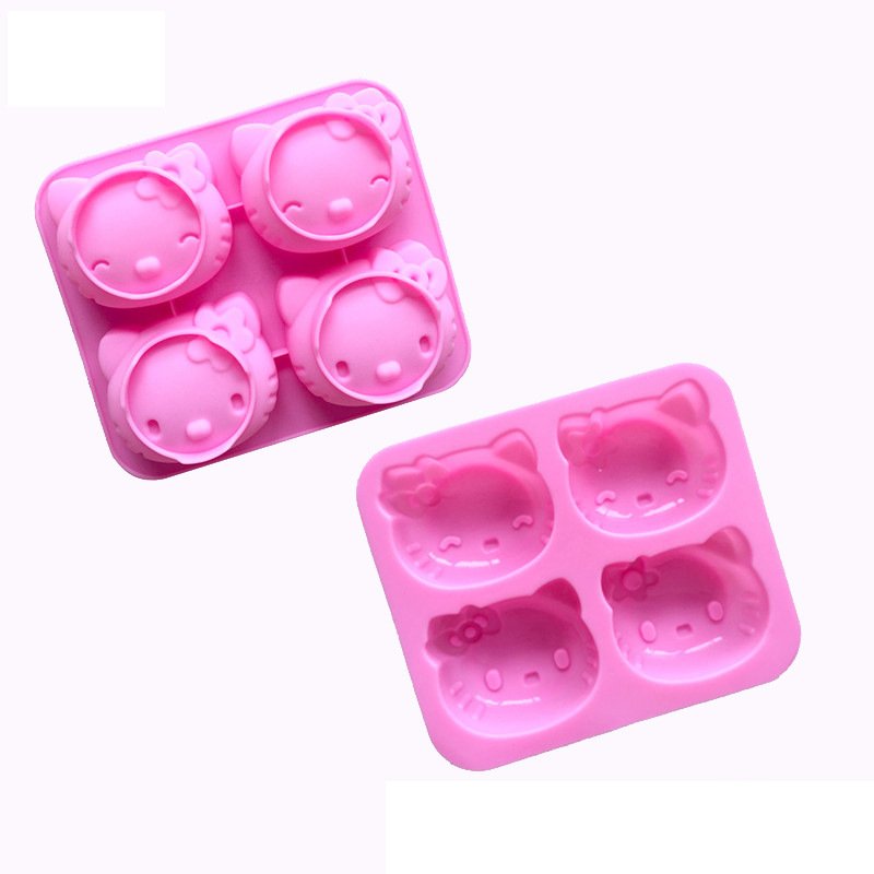 Top down view of durable pink 4-cavity cartoon cat silicone mold for handmade soap and desserts