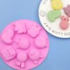Front view of pink 8-cavity pet dog and unicorn silicone baking and soap mold