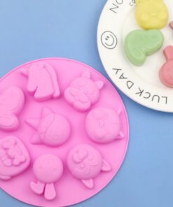 Front view of pink 8-cavity pet dog and unicorn silicone baking and soap mold