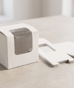 9x9x8 cm white window packaging box assembled next to flat-packed cartons on neutral background