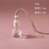 Vedini 10ml hanging car perfume bottle with transparent glass body, natural wooden cap and braided rope.