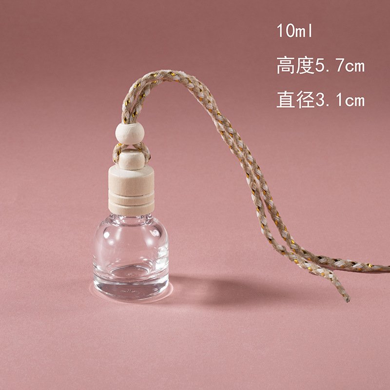 Vedini 10ml hanging car perfume bottle with transparent glass body, natural wooden cap and braided rope.